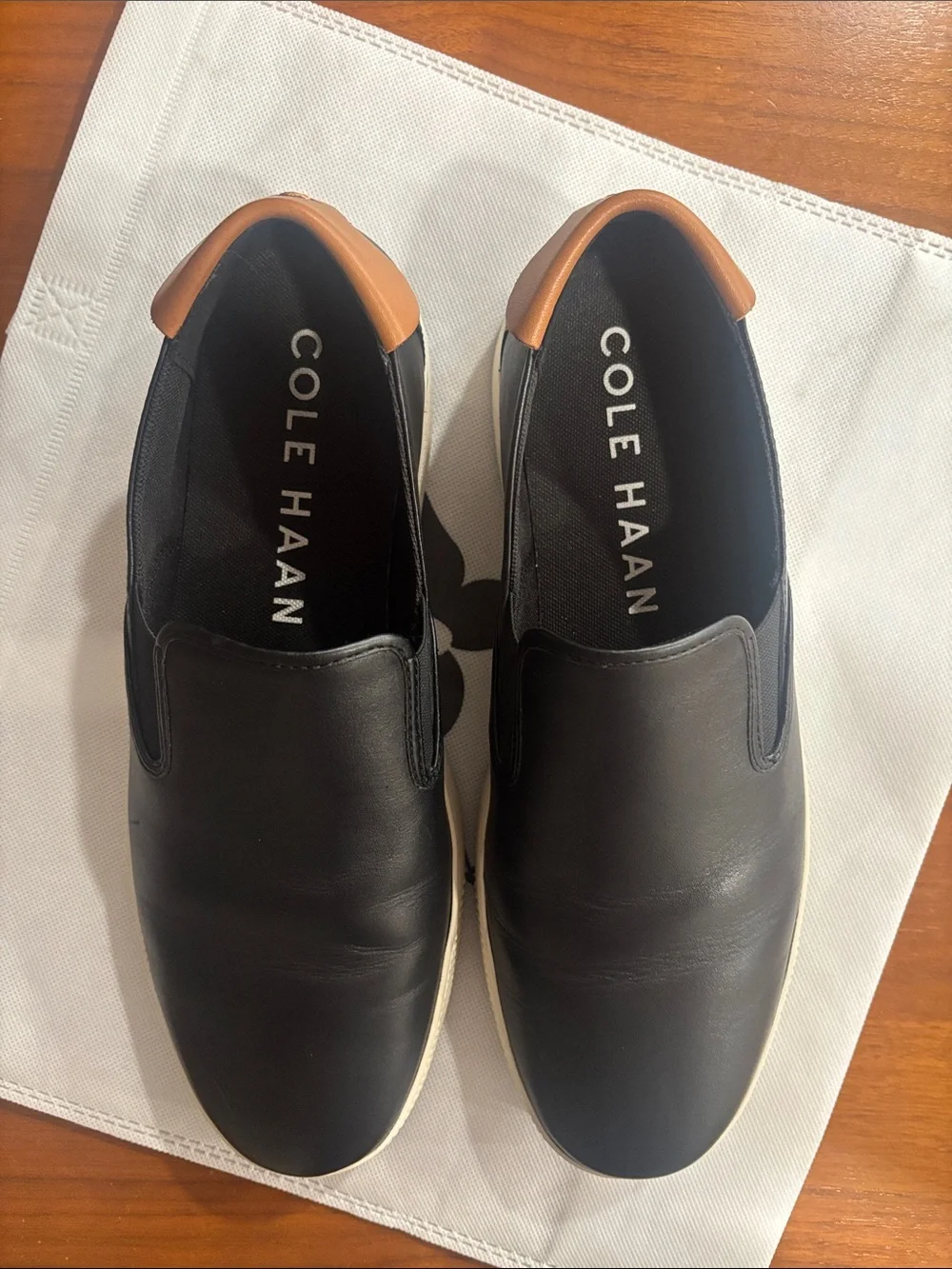 Cole Haan Black Leather Slip-On Sneakers with Tan Heel Tab